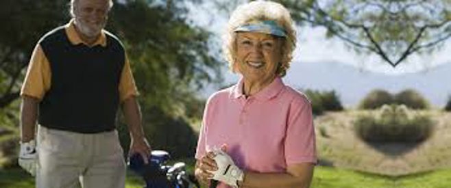 old lady and husband golfing